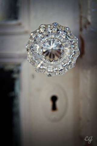 Antique outside door knob by farmhouse touches